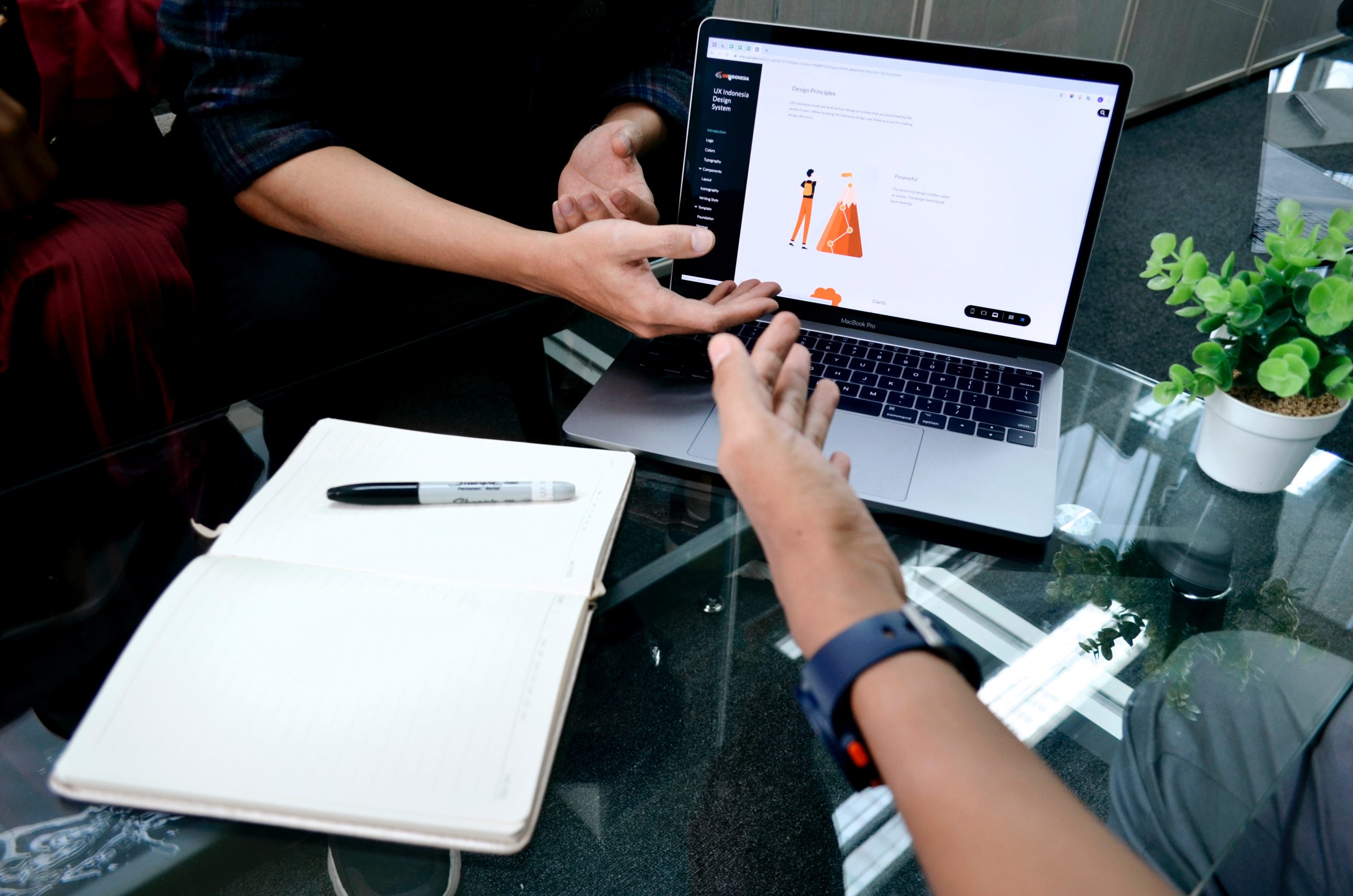 Two hands near to laptop
