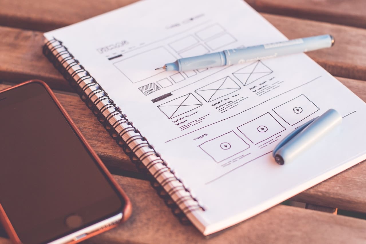 a notepad with ui design sketches